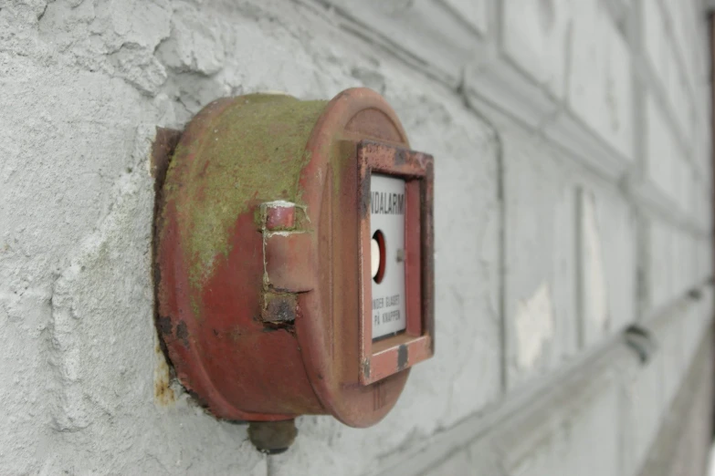 a red object attached to the side of a wall