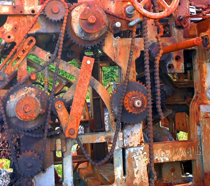 an old machine has rusty gears all over it