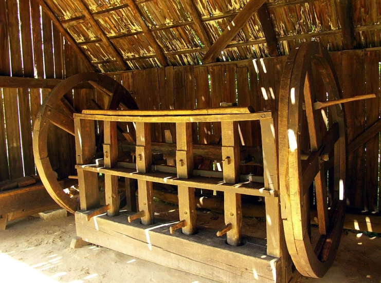 a big wooden machine is inside a building
