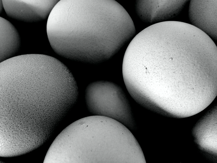 a pile of eggs is shown in black and white