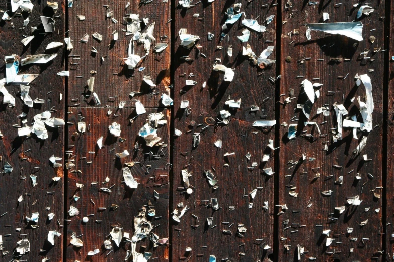 an image of a wood fence covered with debris