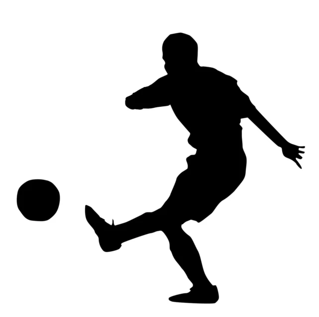 a soccer player is kicking the ball
