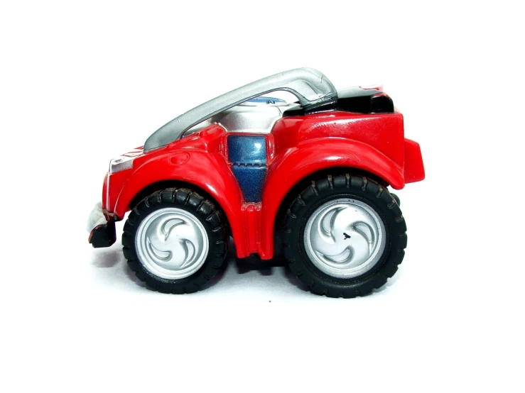a toy red truck on a white background