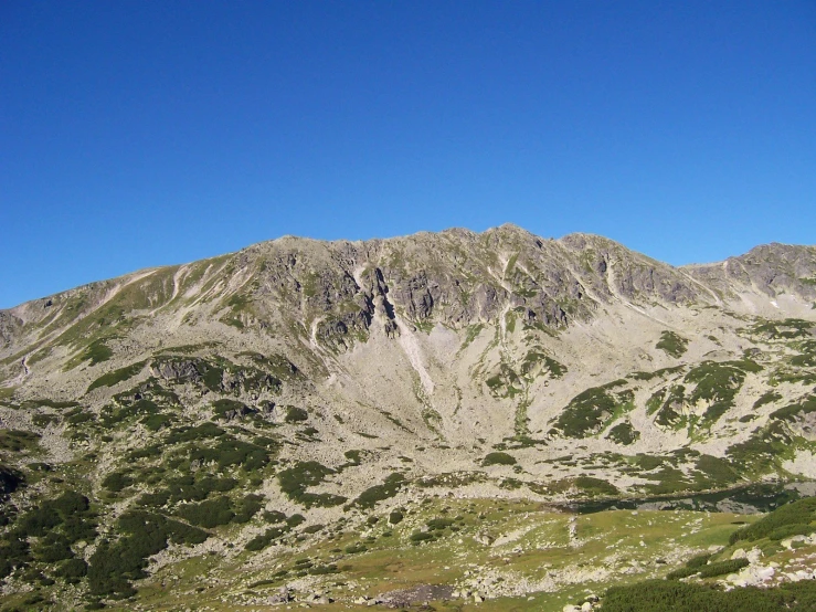 mountains that are very high up on the side of a hill