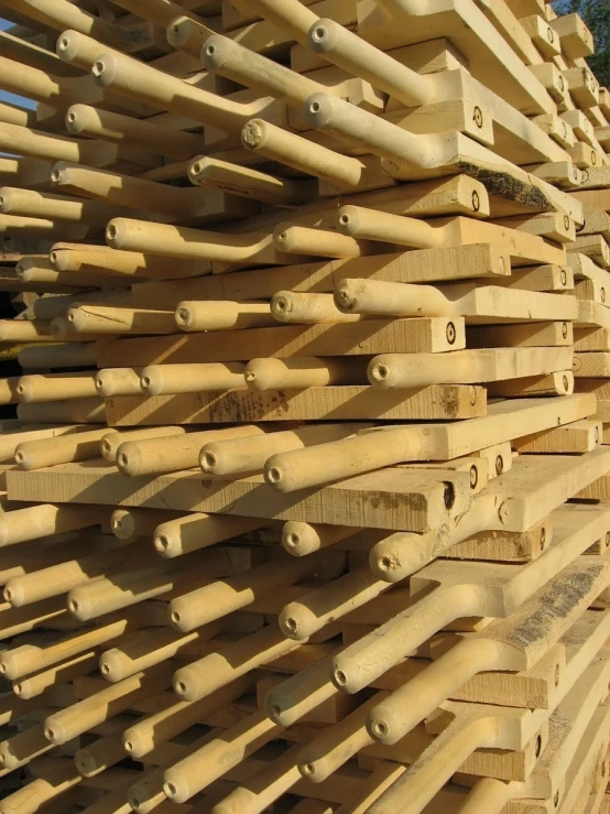several wooden boards and pegs are stacked together