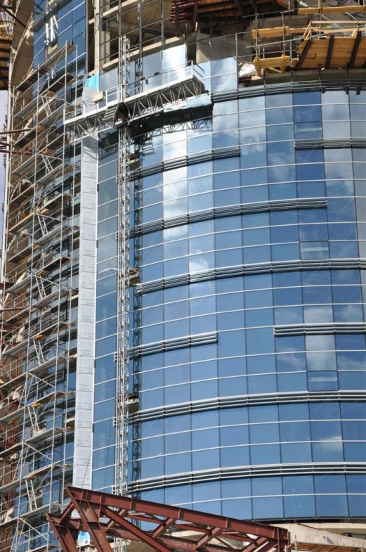 a building with several windows being constructed