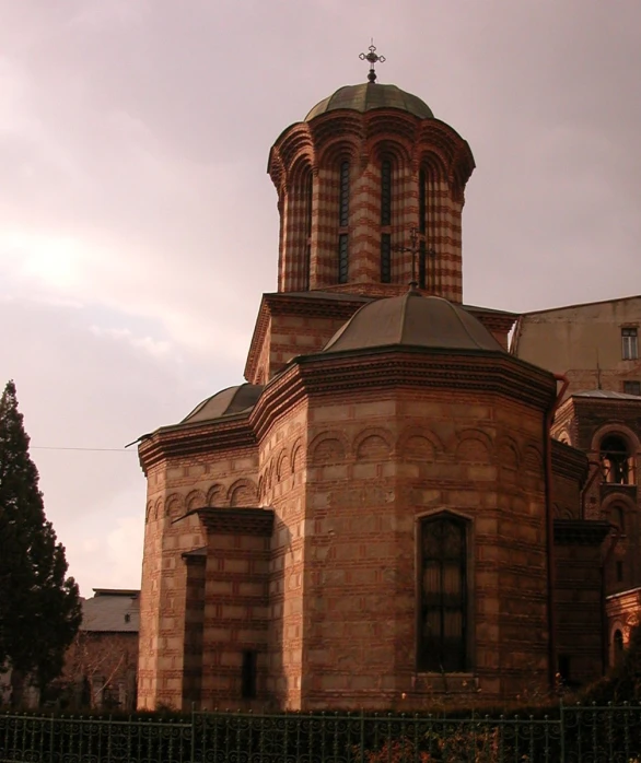 an old stone building with a tall tower