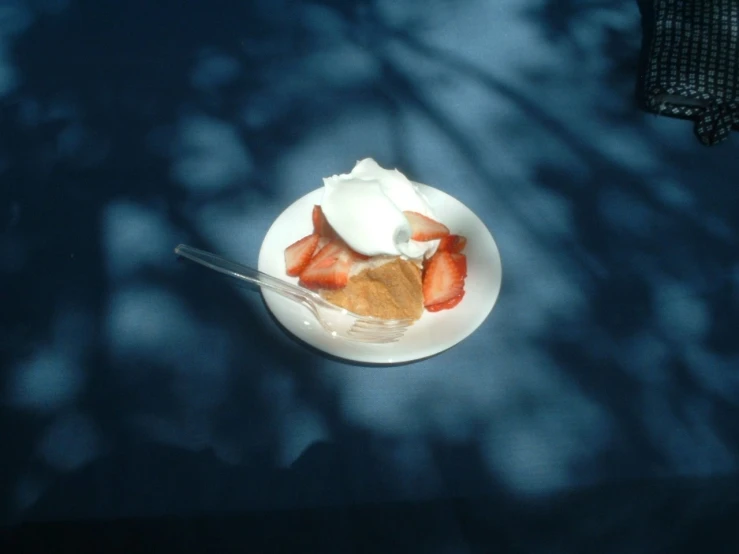 dessert with strawberries is on a white plate