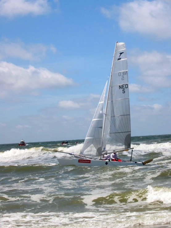 a boat in the ocean with water splashing around