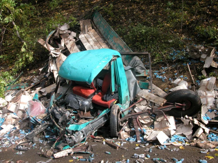 a pile of junk and rubble with an orange chair