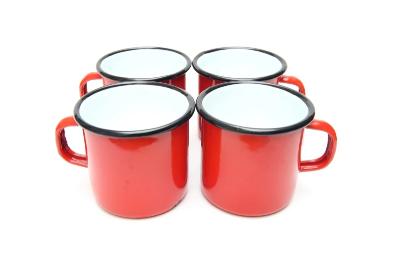 a picture of four red and white coffee mugs