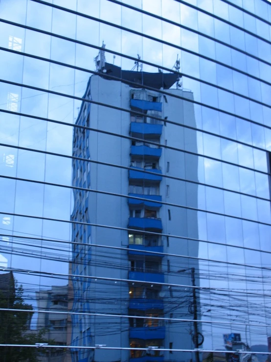 a glass walled wall with an architectural feature in the foreground