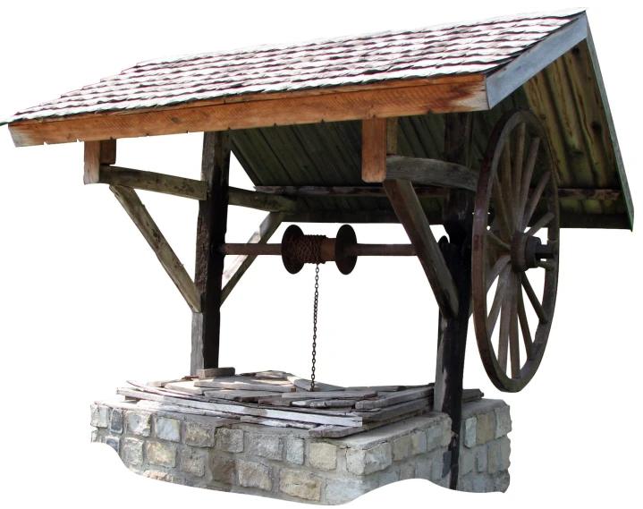 a wooden structure with metal wheels and bricks