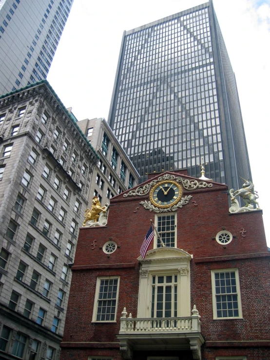 there is a clock on the corner of this building