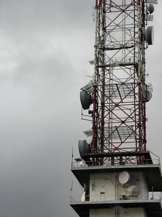 a very tall tower with many different antennas