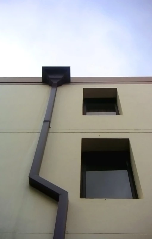 the facade of an apartment building is angled down