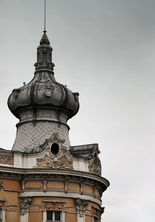 an old building with a clock on the roof