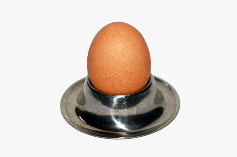 an egg sits on a metal base