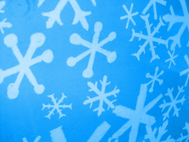 snowflakes drawn in white on a blue background