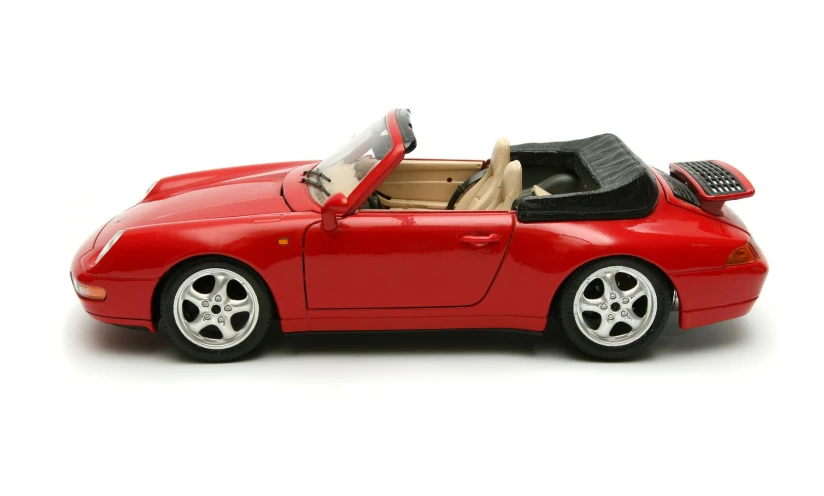 a toy car with a red interior and black leather