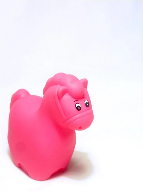 a pink toy sitting on top of a white table