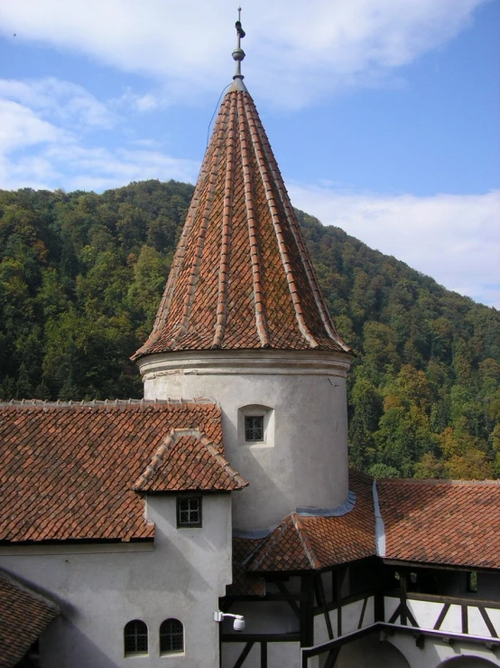 a building with a spire and a dome with arched windows