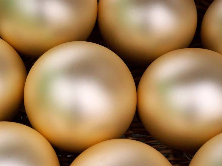 the basket is full of large balls of white and brown color