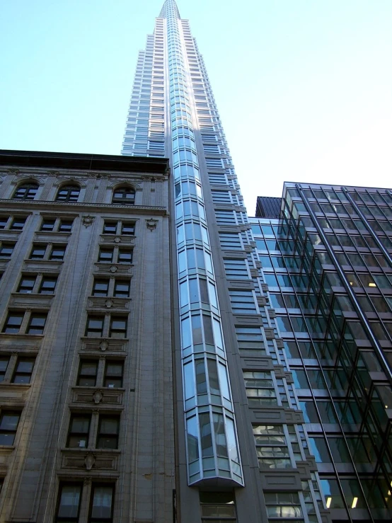 an upward view of an apartment building in the city