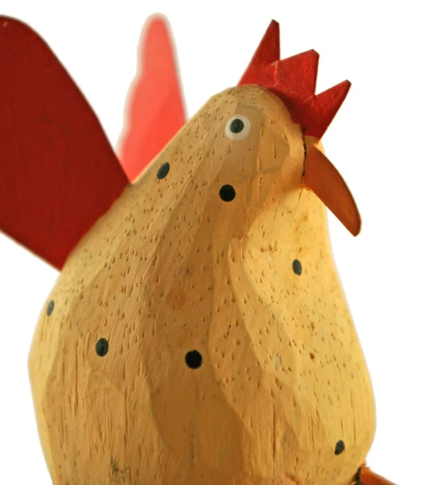 a wooden chicken made to look like a chick