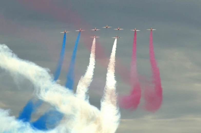 six jets fly in formation with each other