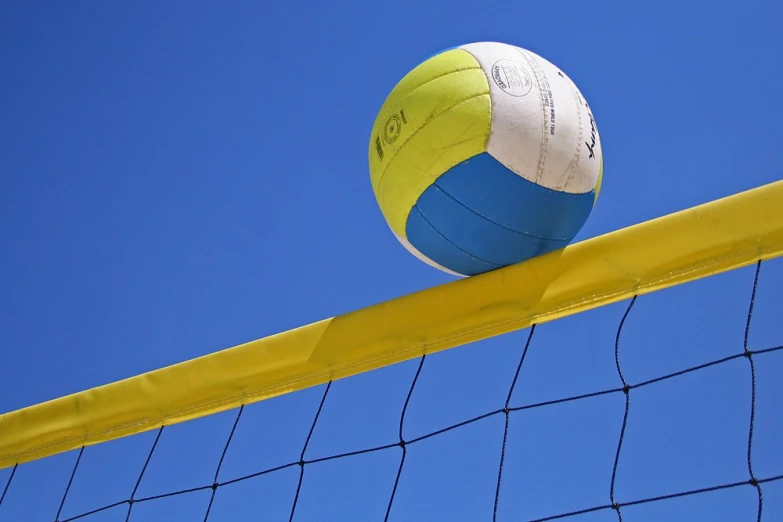 a beach ball is sticking out of a net