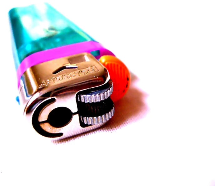 closeup of a colorful multi colored tooth brush on a white surface