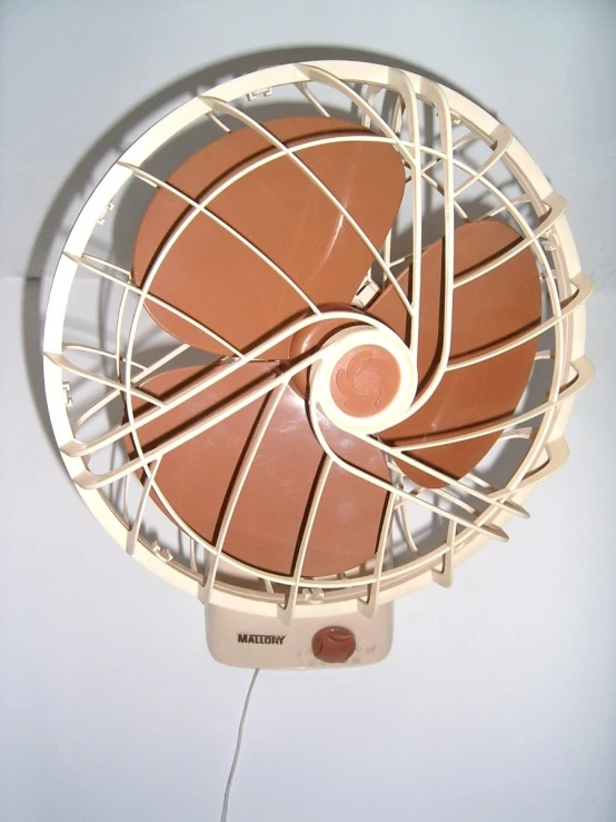 an old fashioned fan on a table in a room