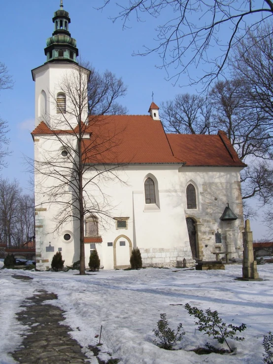a large white church with red tiled roof