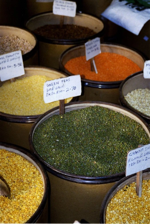 various spices are shown on several different bowls