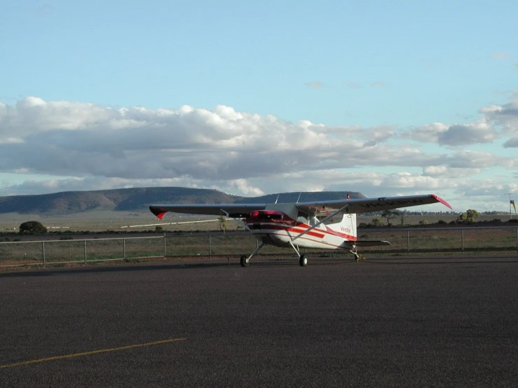 a small propeller plane is parked in an airport