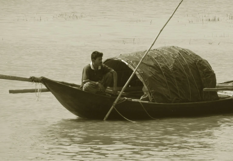 two people in a boat on the water