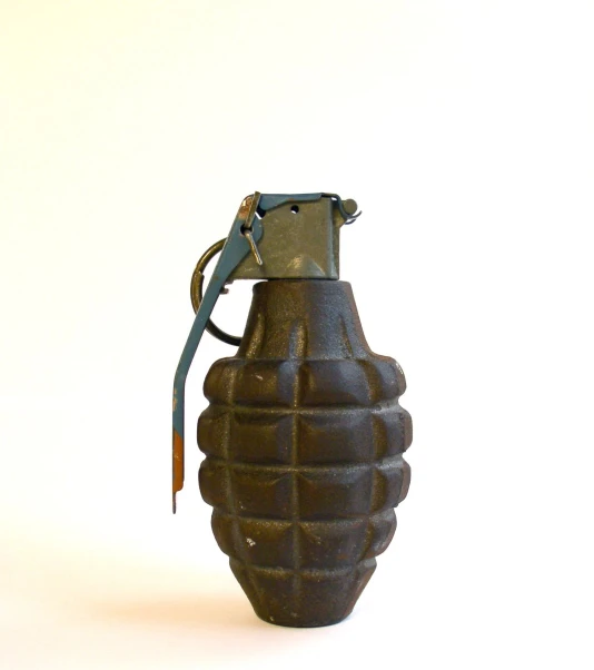 a small ceramic bug bottle with handles