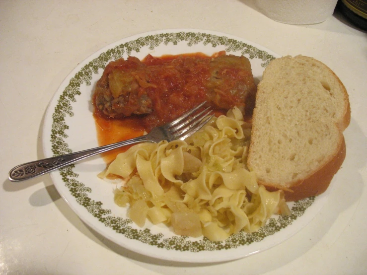 a plate full of food and some bread