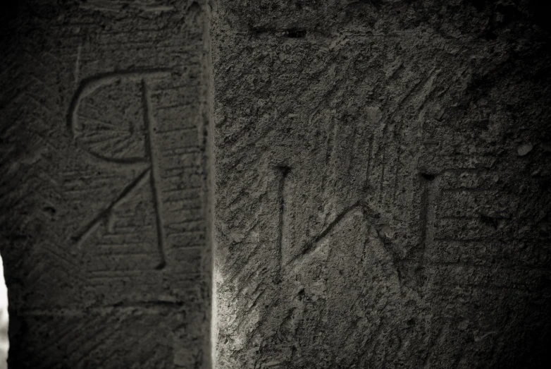 a couple of stone slabs with carvings on them
