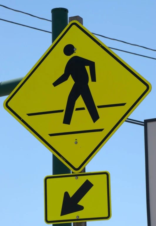 a road sign showing a man crossing the road