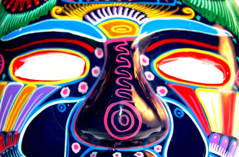 an artistic mask has many designs on it