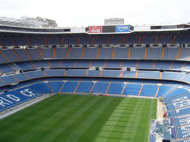 the inside view of an empty stadium soccer field