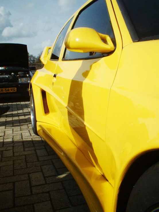the side of the yellow car is slightly blurred