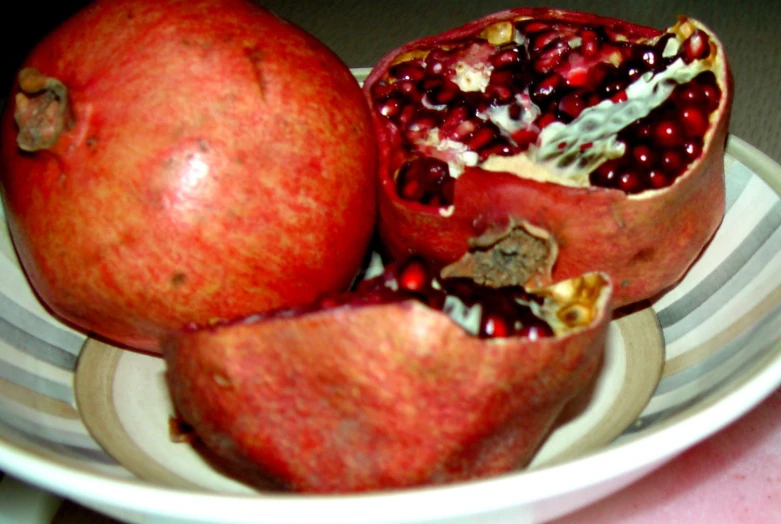 a plate with pomegranates on top of it