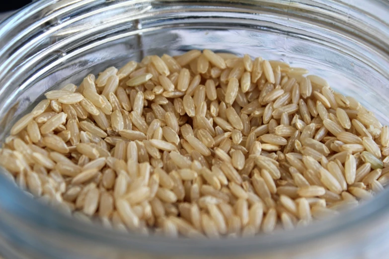 the top portion of an empty jar of brown rice