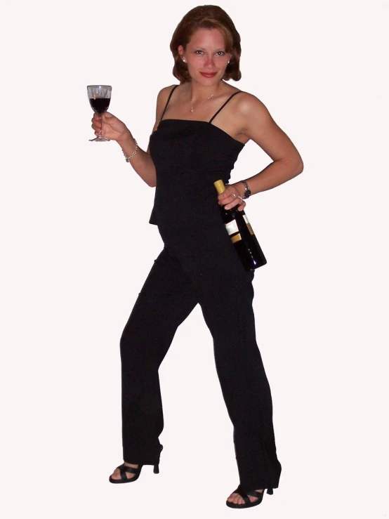 woman with an outstretched leg holding a wine glass and bottle