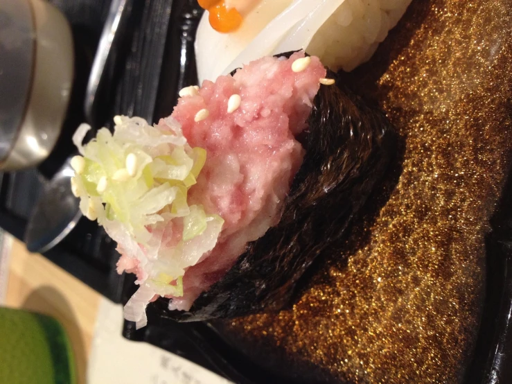 a sushi plate with two sushi patties on the side