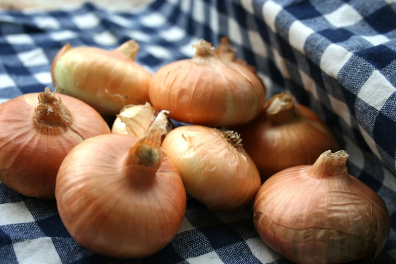 a pile of onions that are sitting on a table