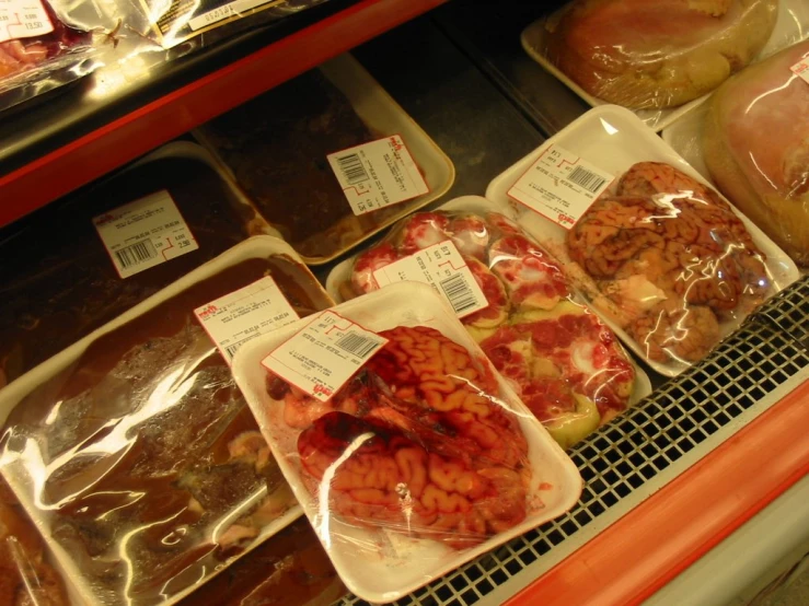 several plastic trays filled with different types of food